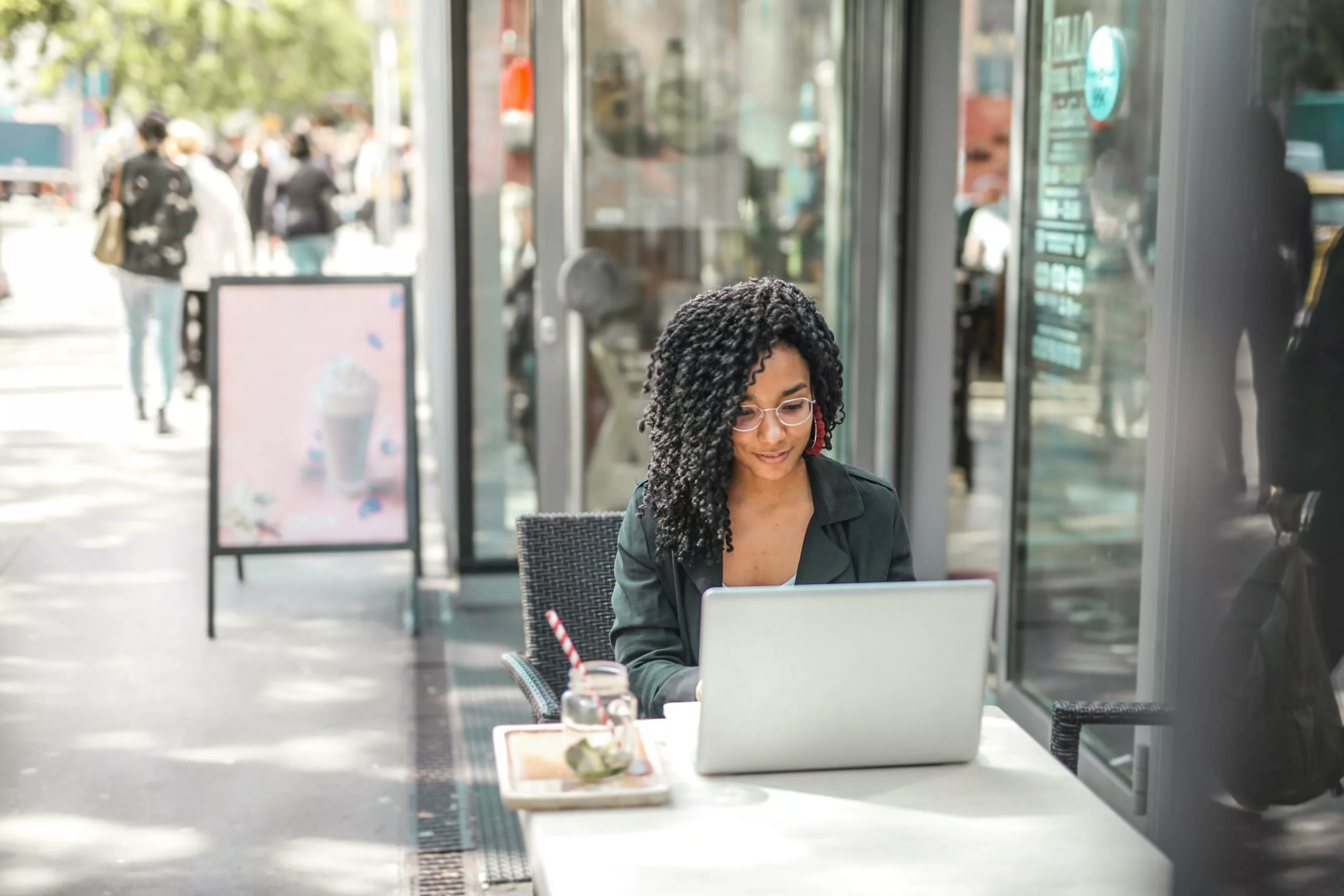 Person sitting calmly at a desk managing work stress